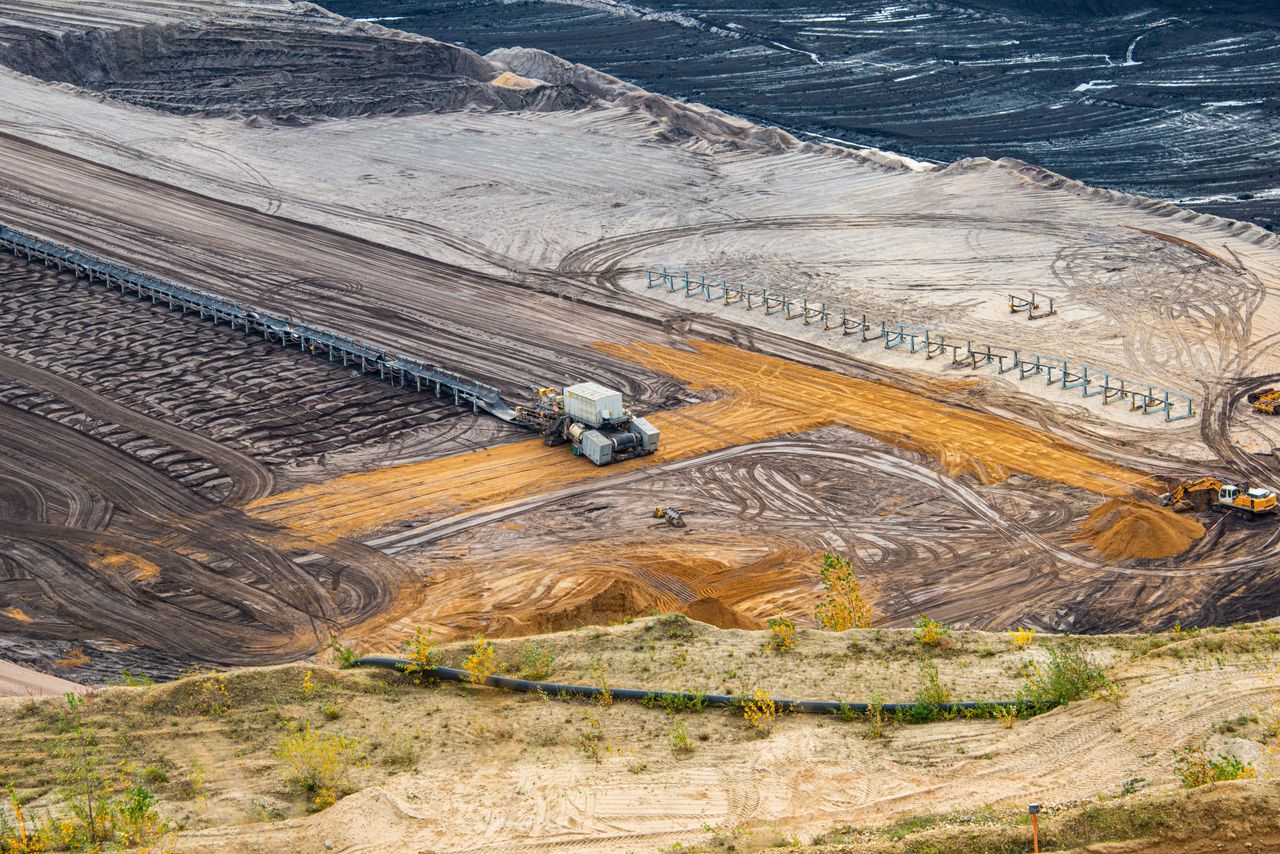 Expansive view of mining equipment and terrain in Jüchen, Germany.